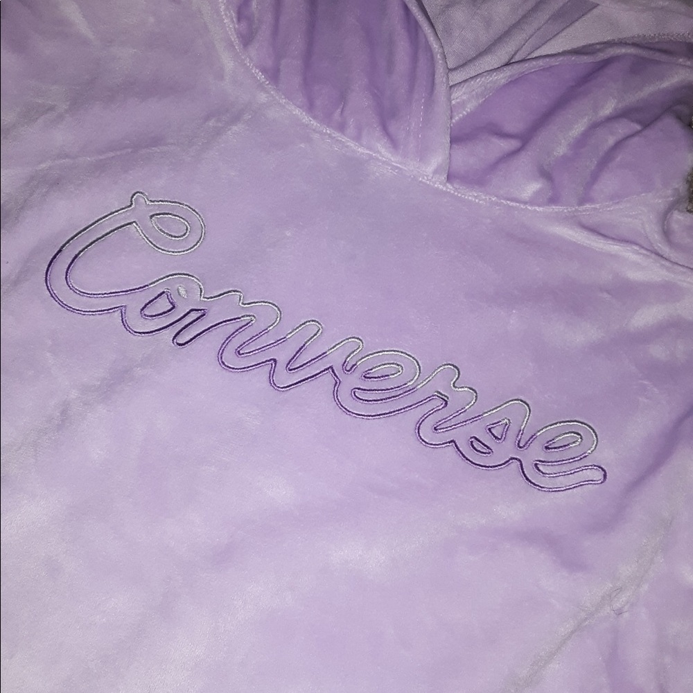 A purple converse hoodie